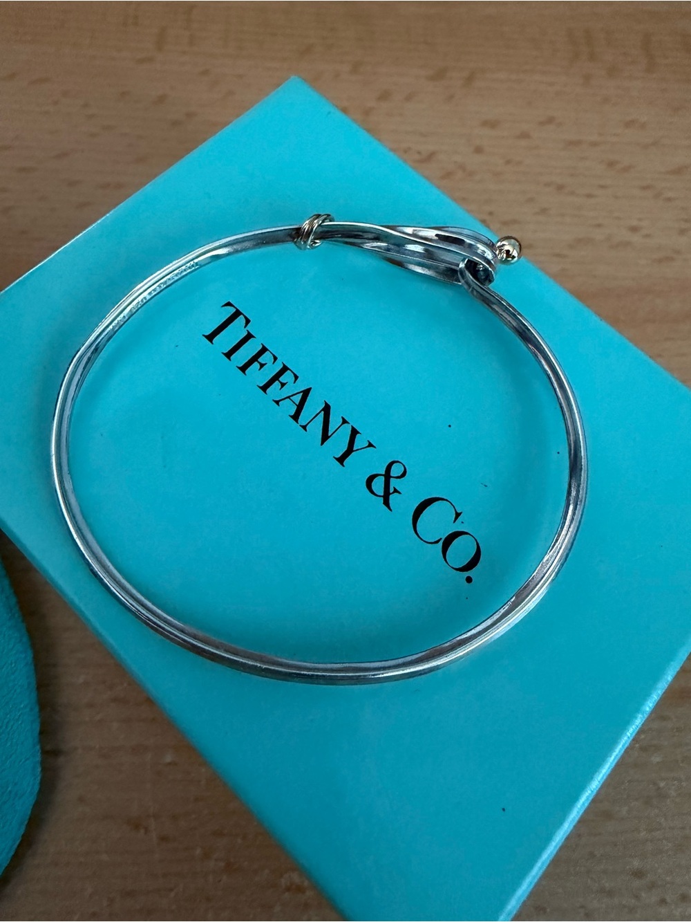 Tiffany & Co. Sterling Silver Bangle with Gold Knot Accent